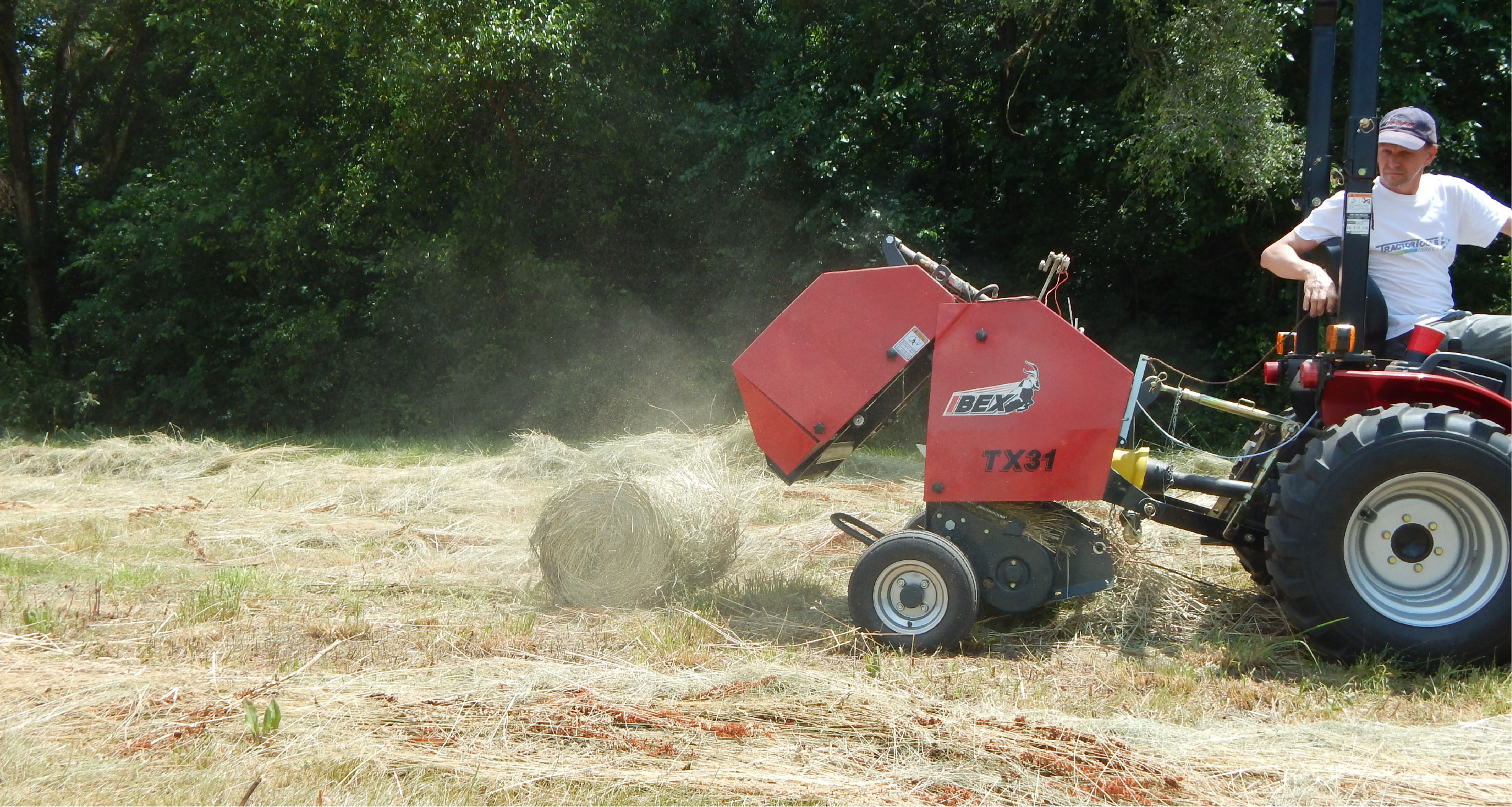 Ibex TX31 Mini Round Baler with Twine Wrap ejecting an mini round hay bale. 