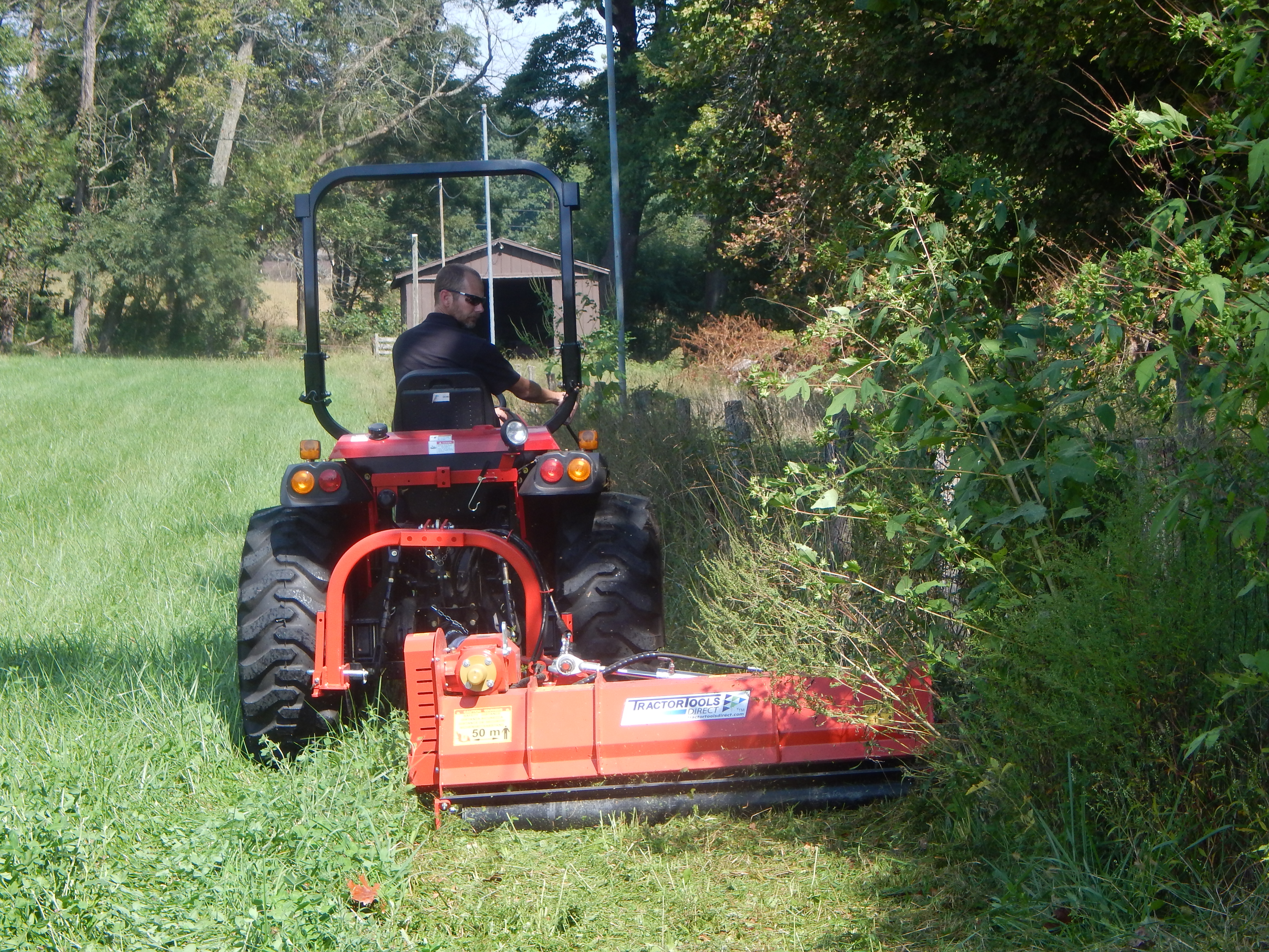 Mowing overgrown pasture perimeters with an Ibex TM62 Hydraulic Offset Flail Mower.