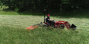 Mowing a hay field with an Ibex TX45 Drum Mower.