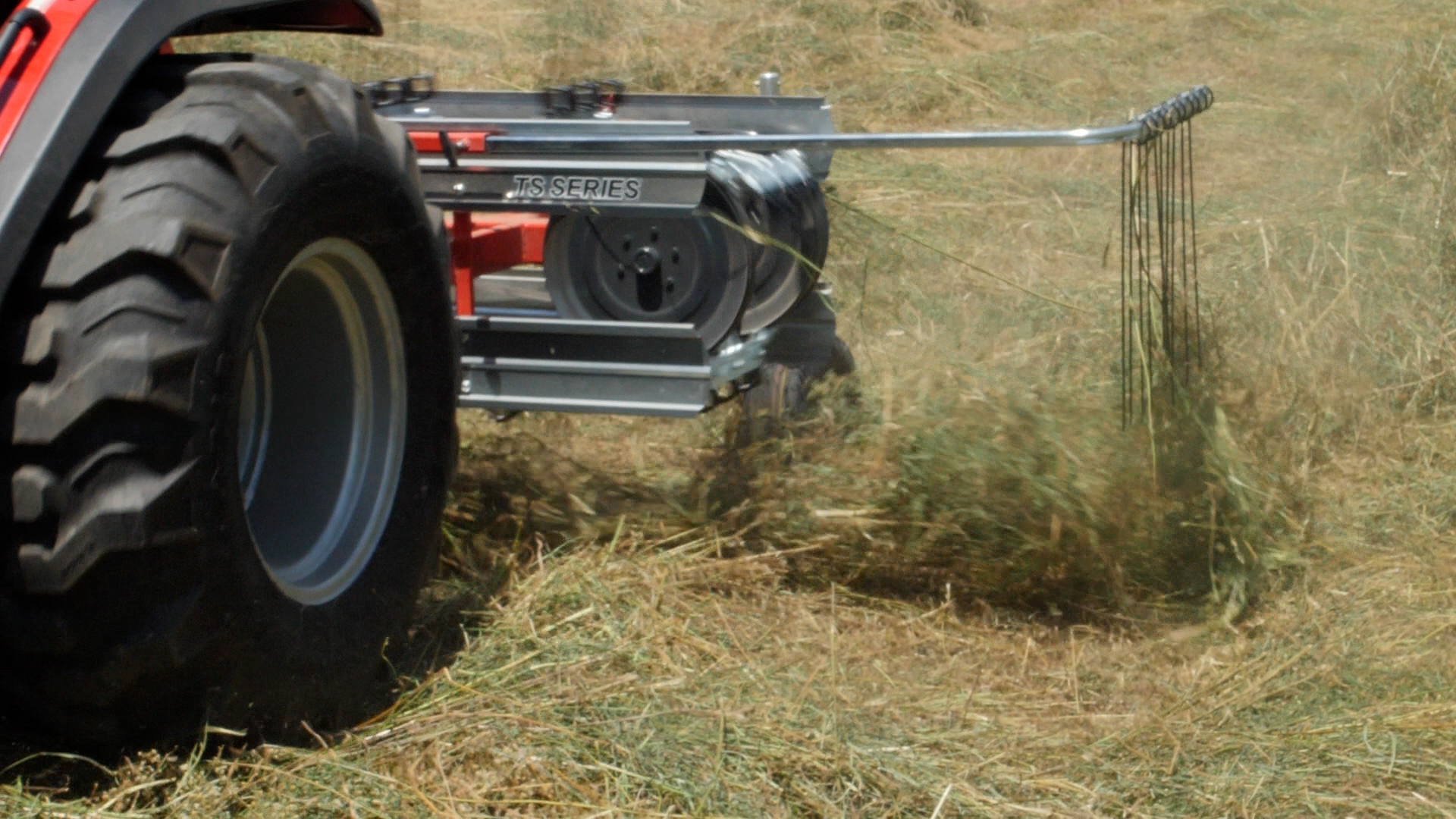 A close up of the hay stop on an Ibex TS100 Belt Rake while raking hay for baling. 
