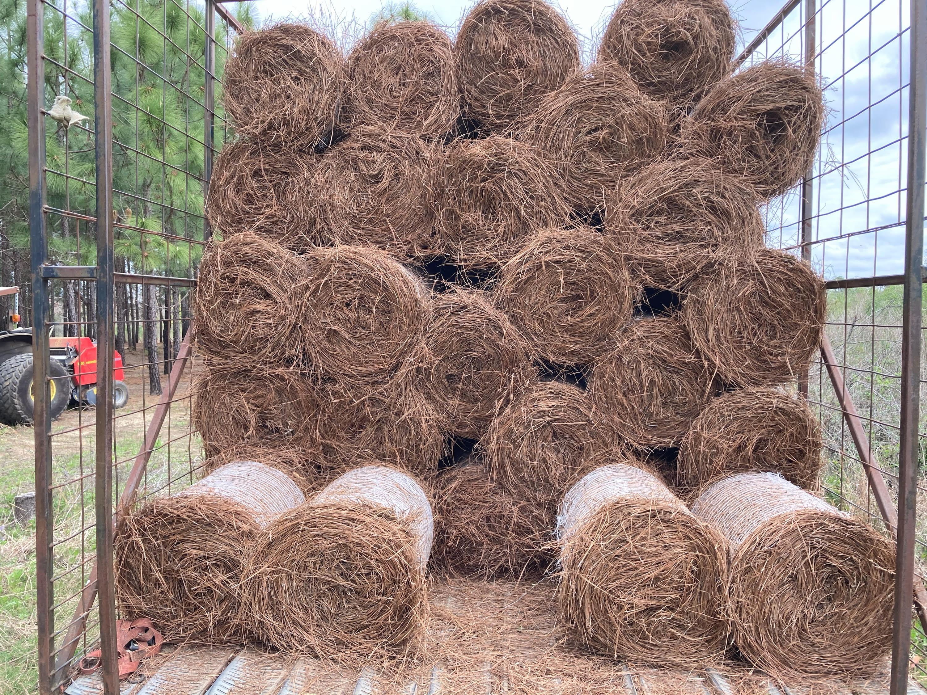 Pine straw bales loaded for transport. Pine straw bales loaded for transport.